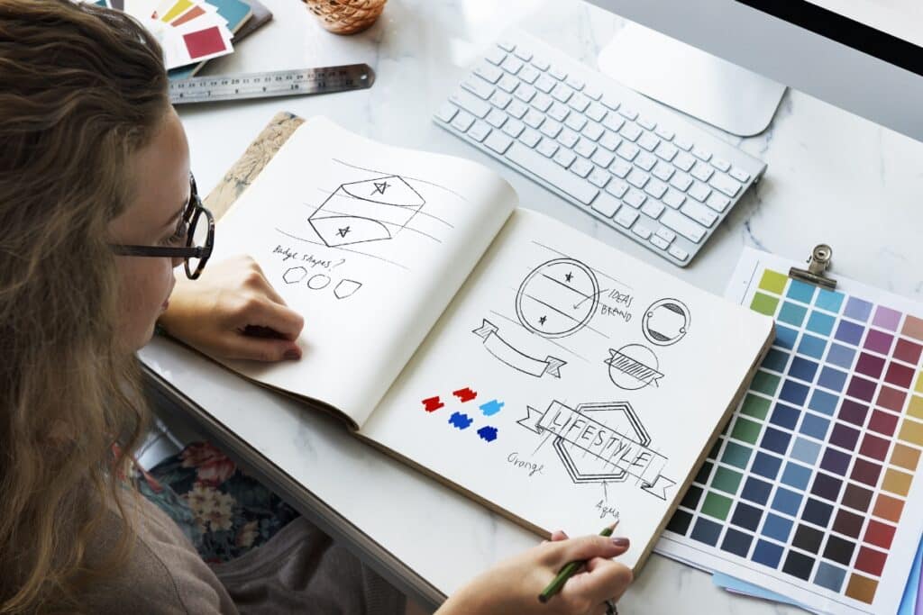 a lady choosing brand colours for a new logo
